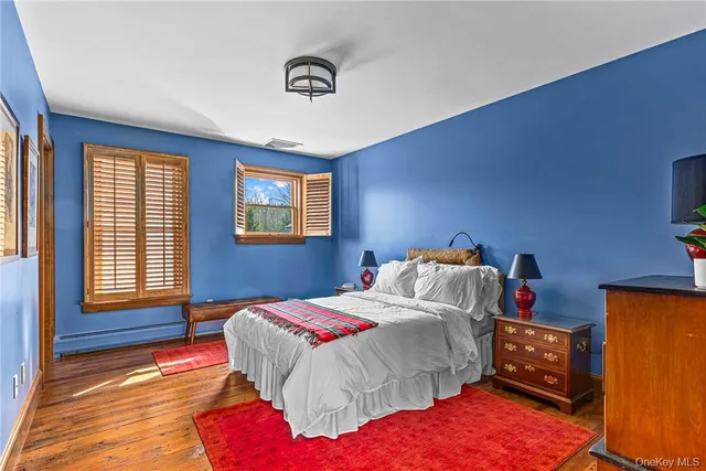 a bathroom with a sink a mirror and a shower