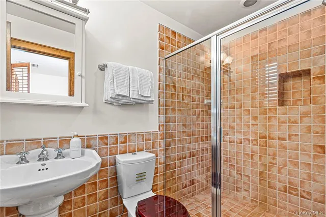 a bedroom with furniture and a wooden floor