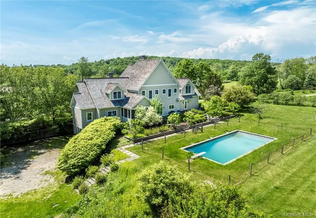 a view of a swimming pool with a yard