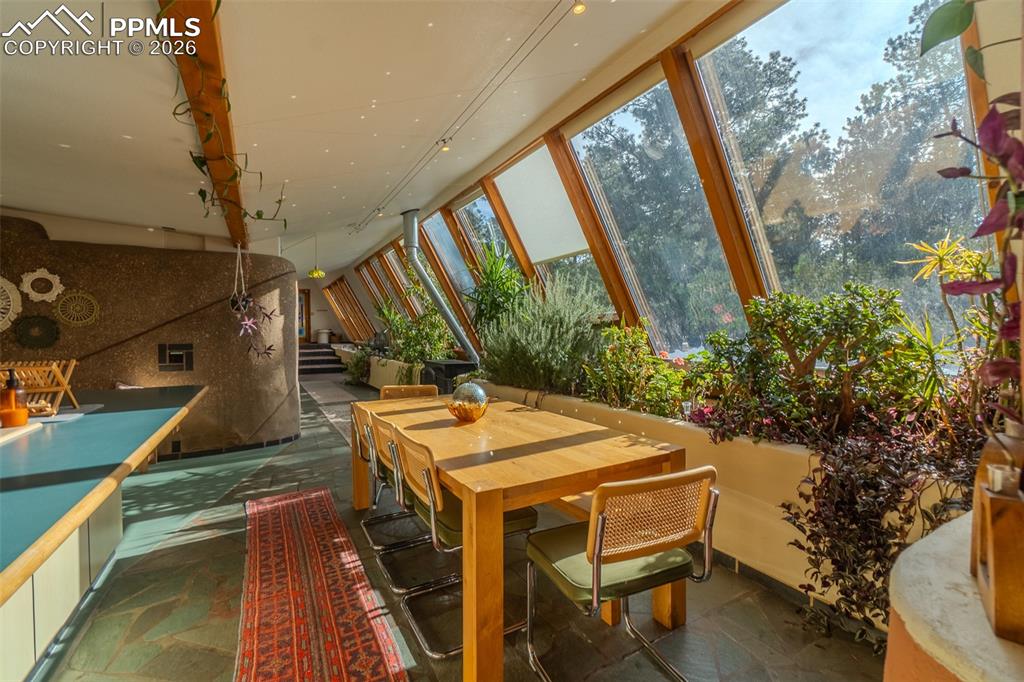 17160 Goshawk Road Colorado Springs, CO 80908 - Photo 16 of 43 a view of balcony with wooden floor and outdoor seating