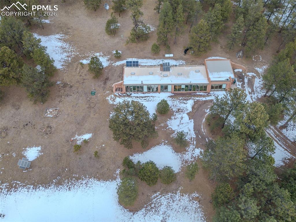 17160 Goshawk Road Colorado Springs, CO 80908 - Photo 41 of 43 a view of a house with a yard