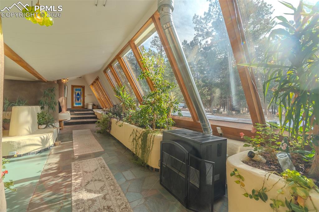 17160 Goshawk Road Colorado Springs, CO 80908 - Photo 10 of 43 a living room with furniture and a large window