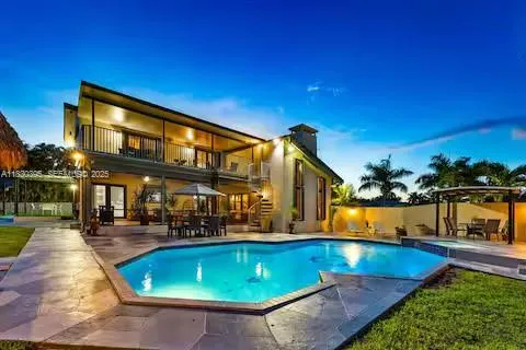 a view of swimming pool with outdoor seating