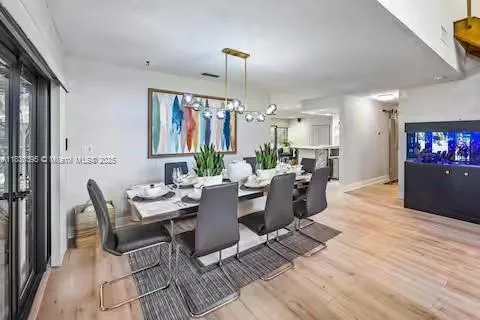 a bedroom with a bed and a large mirror