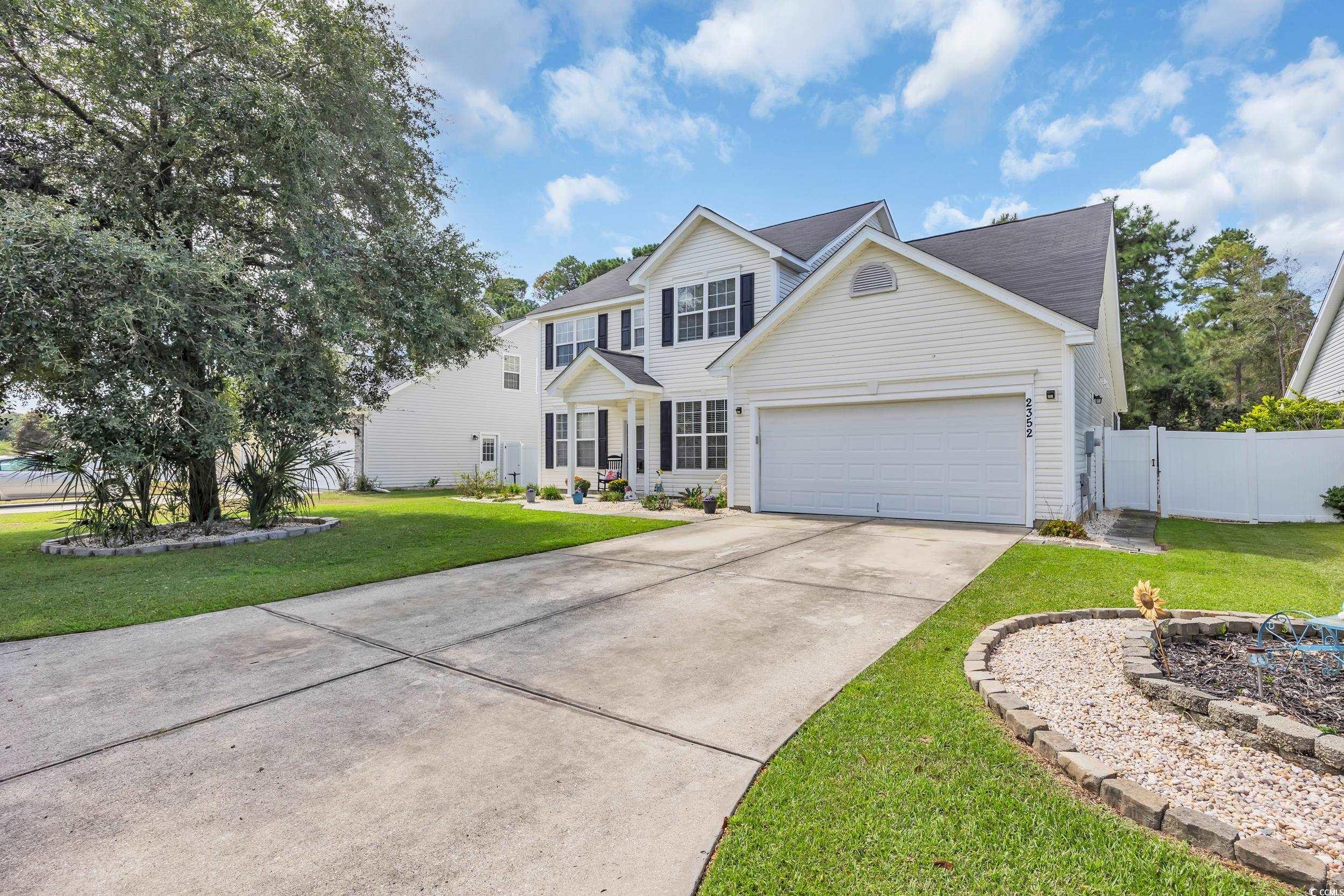 2352 Seneca Ridge Drive Myrtle Beach, SC 29579 - Photo 1 of 40 Traditional-style home featuring concrete driveway, a gate, and a garage