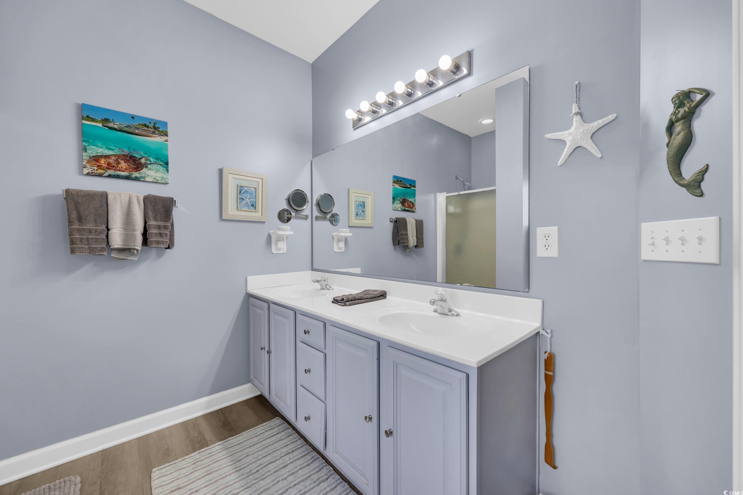 2352 Seneca Ridge Drive Myrtle Beach, SC 29579 - Photo 20 of 40 Bathroom with double vanity, a shower stall, and light wood finished floors