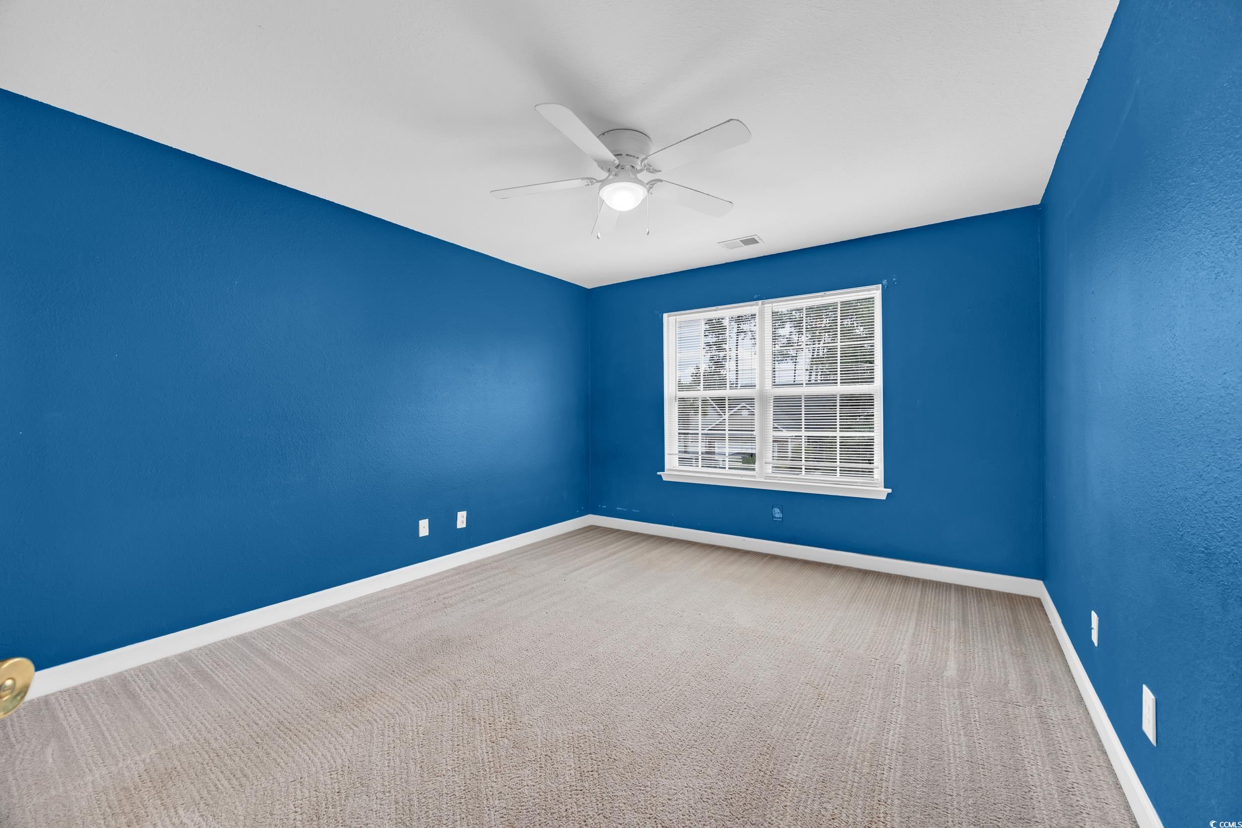 2352 Seneca Ridge Drive Myrtle Beach, SC 29579 - Photo 23 of 40 Carpeted spare room featuring baseboards and a ceiling fan