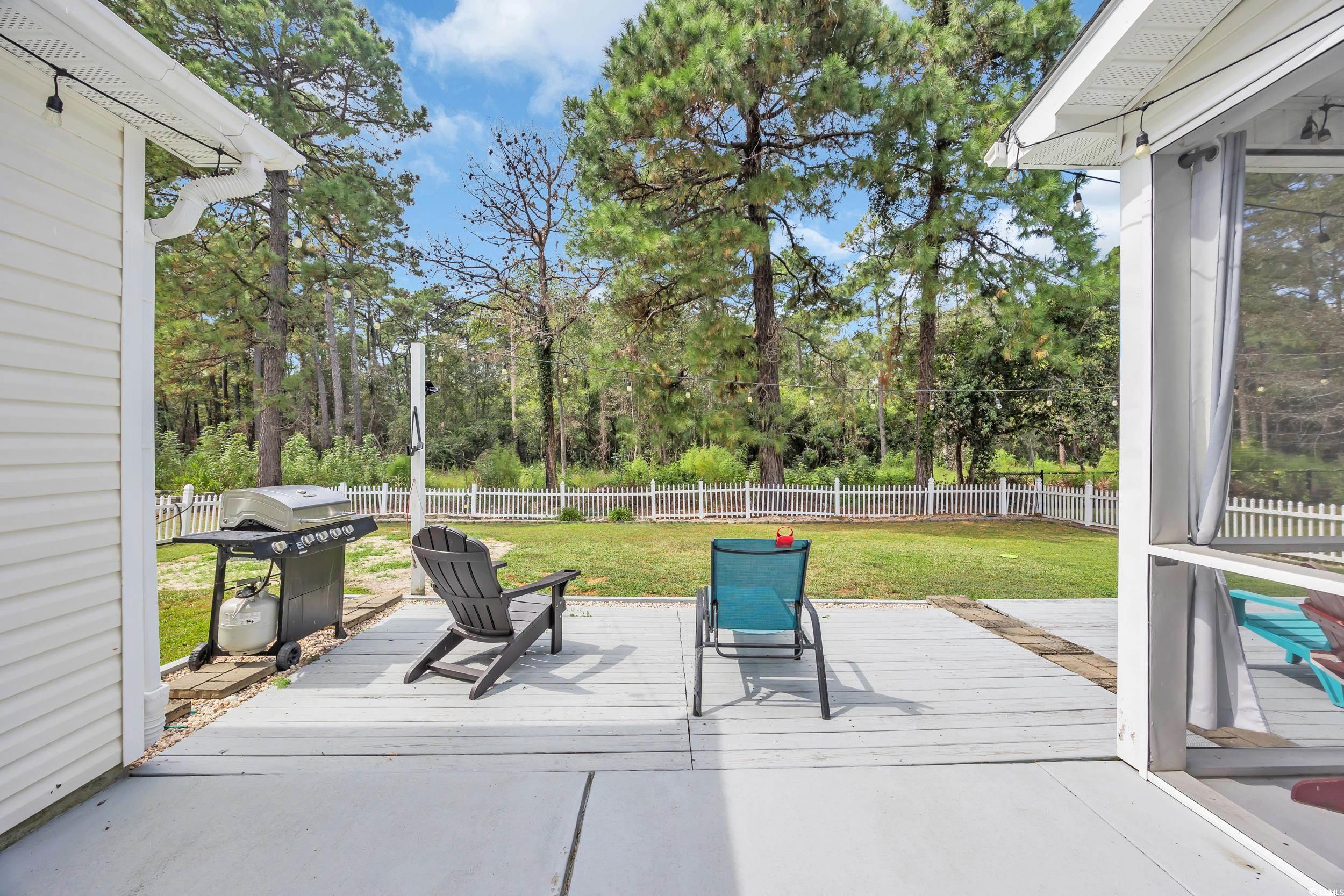 2352 Seneca Ridge Drive Myrtle Beach, SC 29579 - Photo 31 of 40 Fenced backyard featuring a grill, a patio area, and a deck
