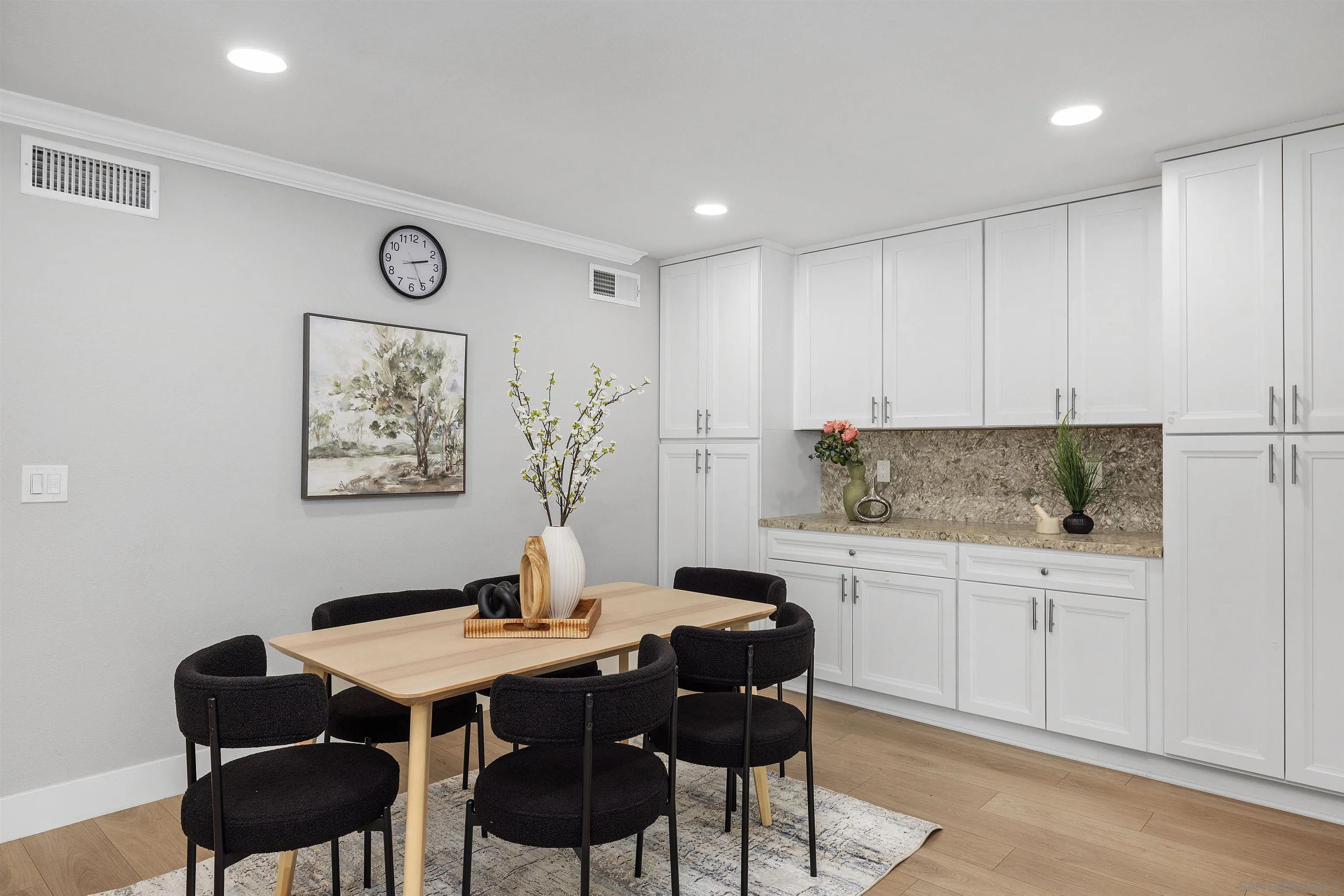 12866 Summerfield Lane Poway, CA 92064 - Photo 26 of 33 a kitchen with a table and chairs in it