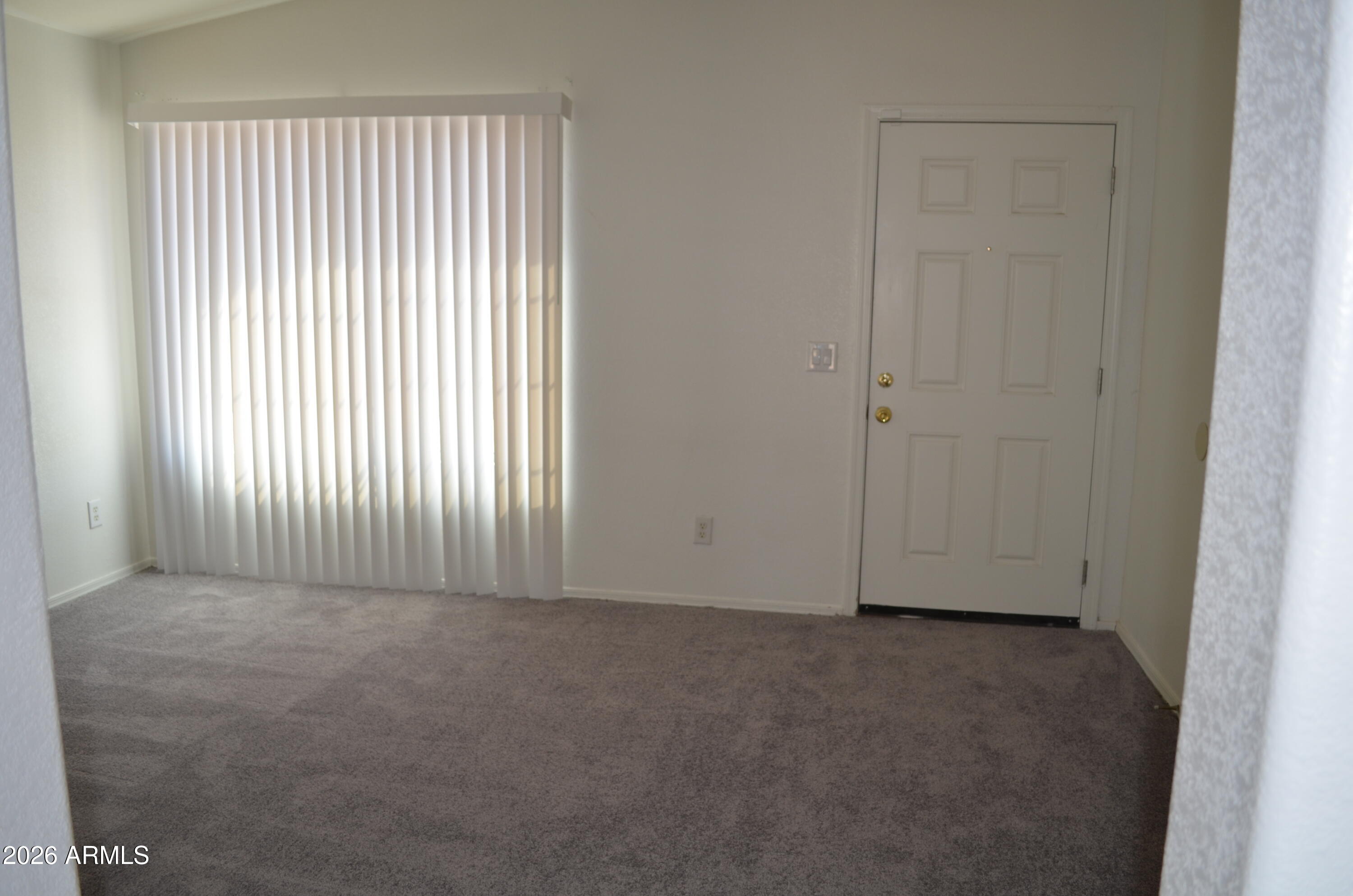 5409 South 11th Street Phoenix, AZ 85040 - Photo 4 of 17 an empty room with windows