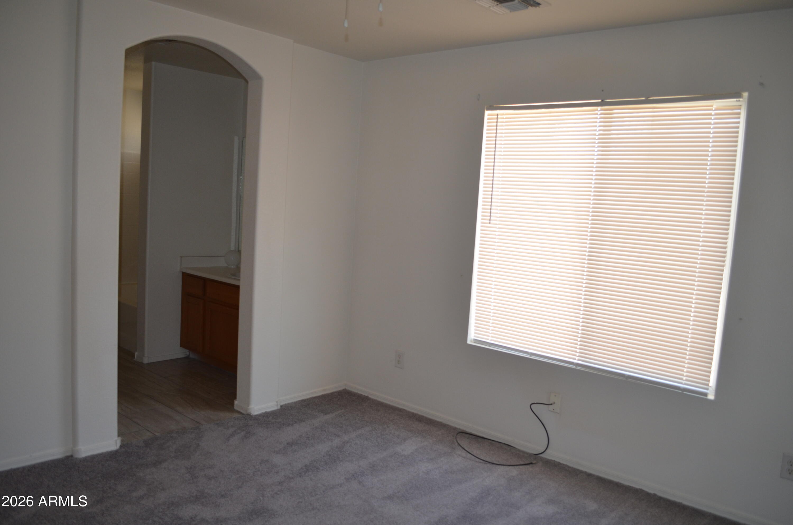 5409 South 11th Street Phoenix, AZ 85040 - Photo 8 of 17 a view of an empty room with a window