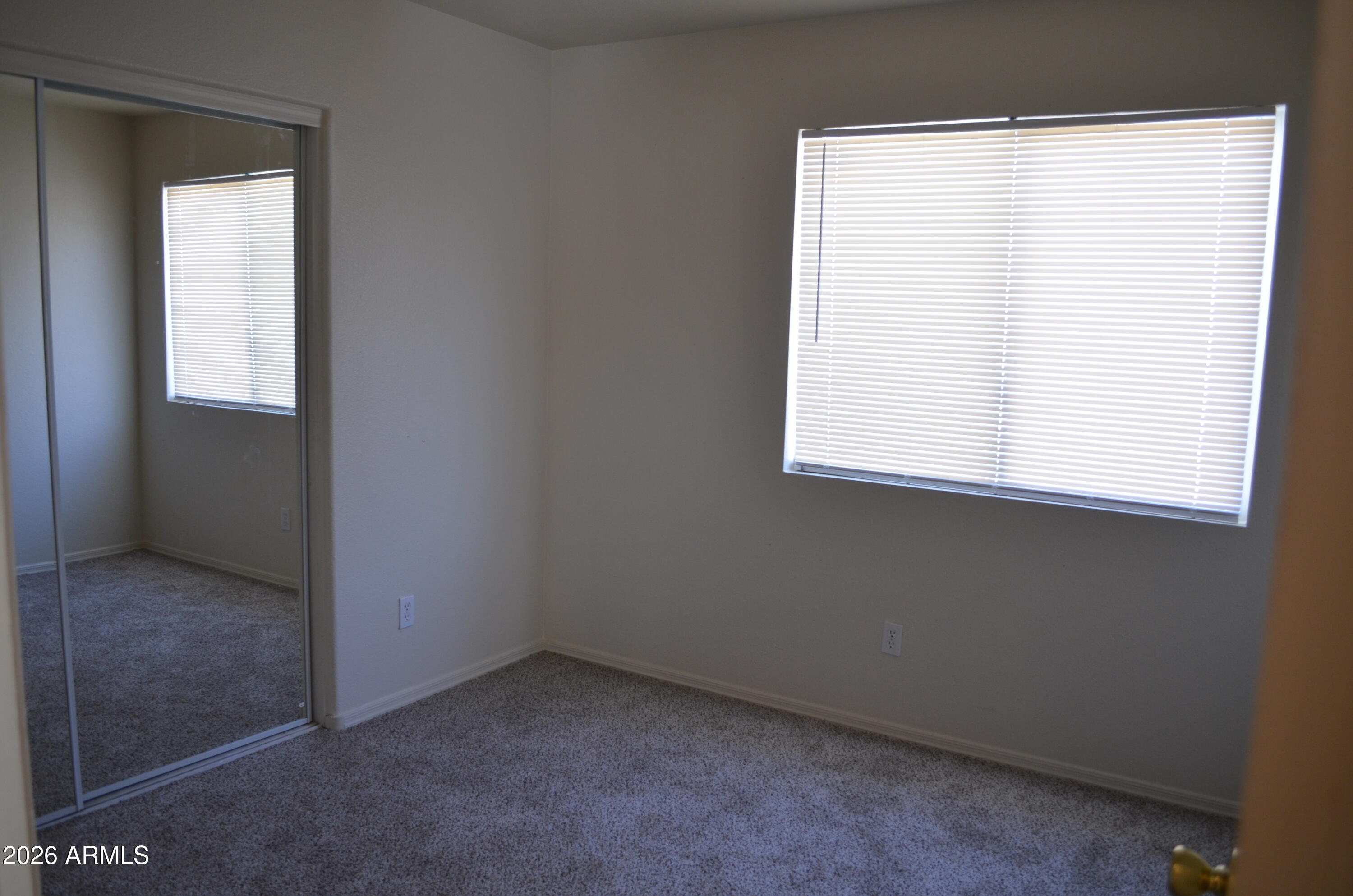 5409 South 11th Street Phoenix, AZ 85040 - Photo 9 of 17 an empty room with a window