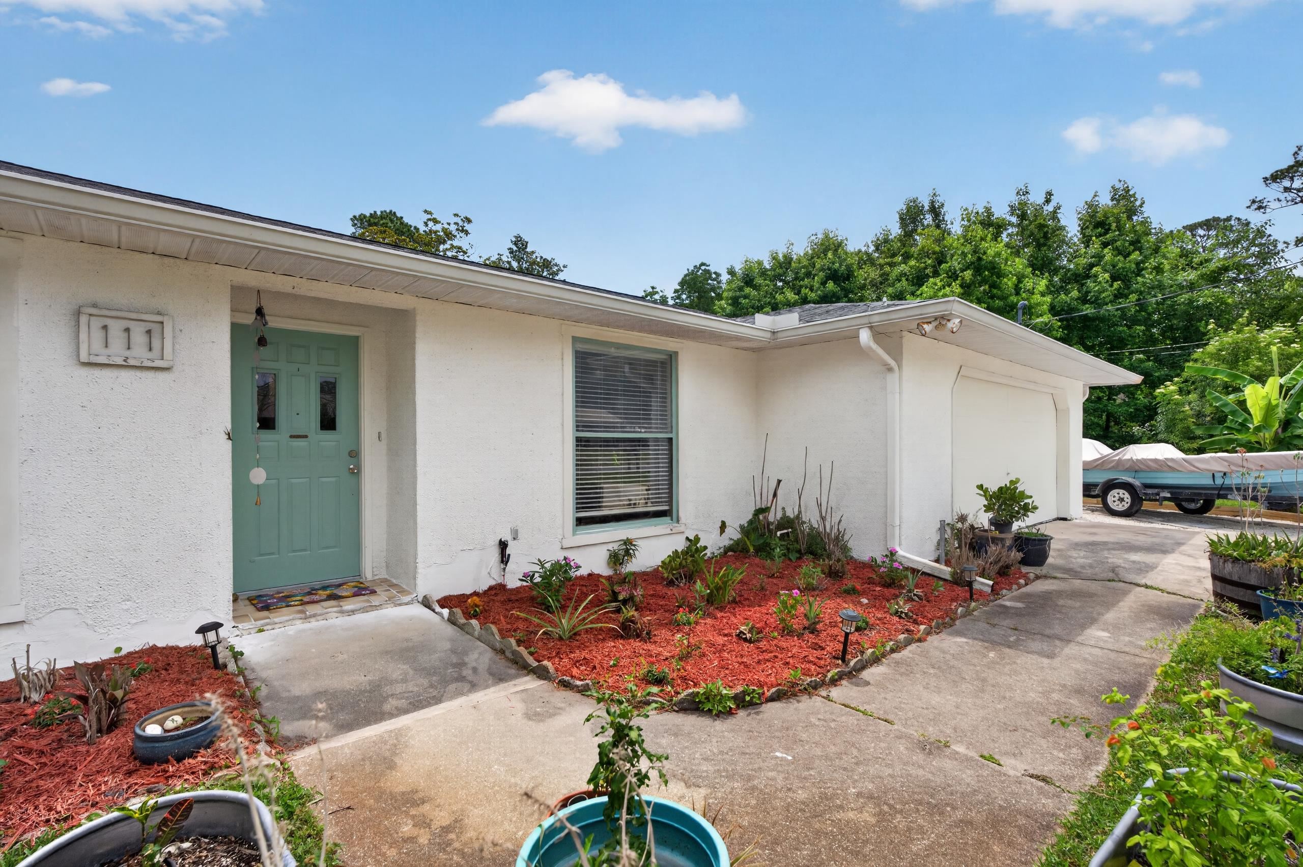 111 Pompano Road St. Augustine, FL 32086 - Photo 47 of 61 a view of a backyard with a patio and plants