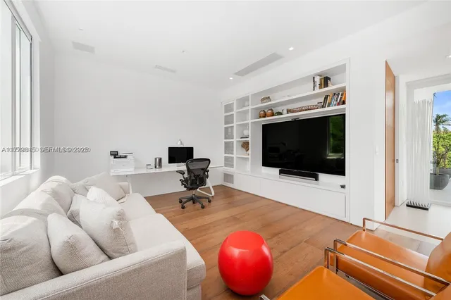 a living room with furniture and a stairs