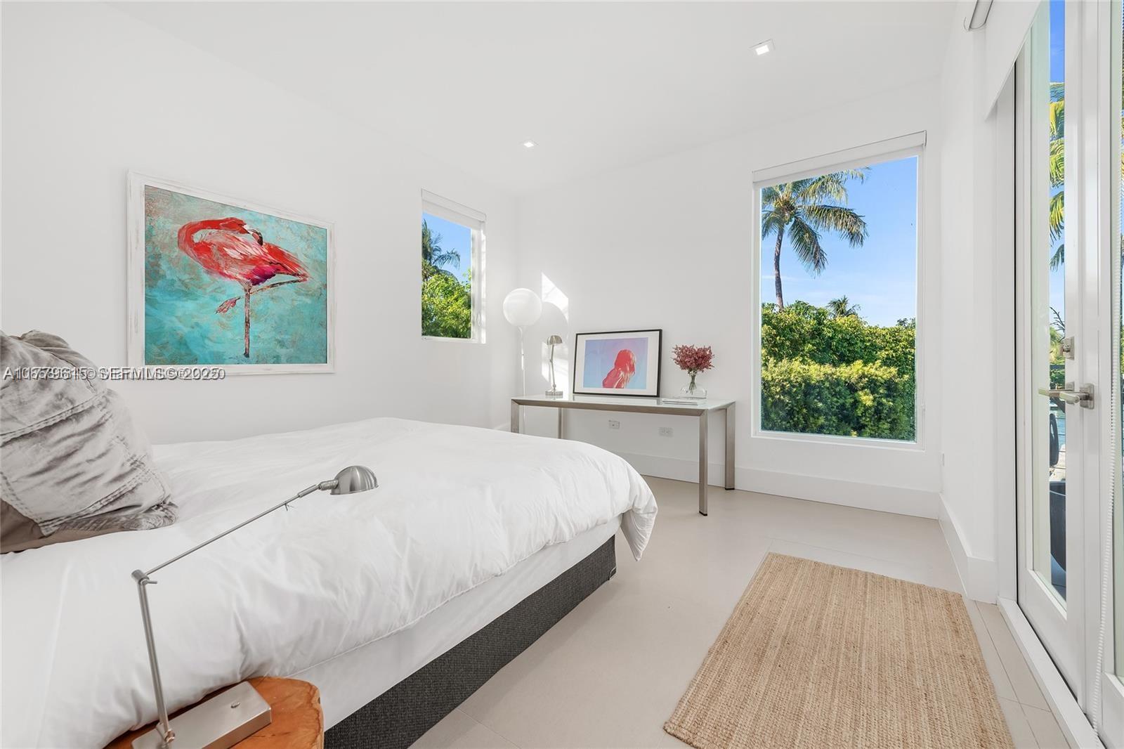 481 South Mashta Drive Key Biscayne, FL 33149 - Photo 23 of 57 a bedroom with a bed and a painting on the wall