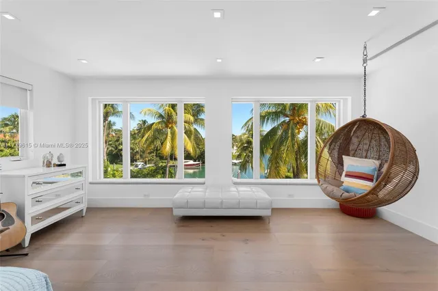 a bedroom with furniture and a window