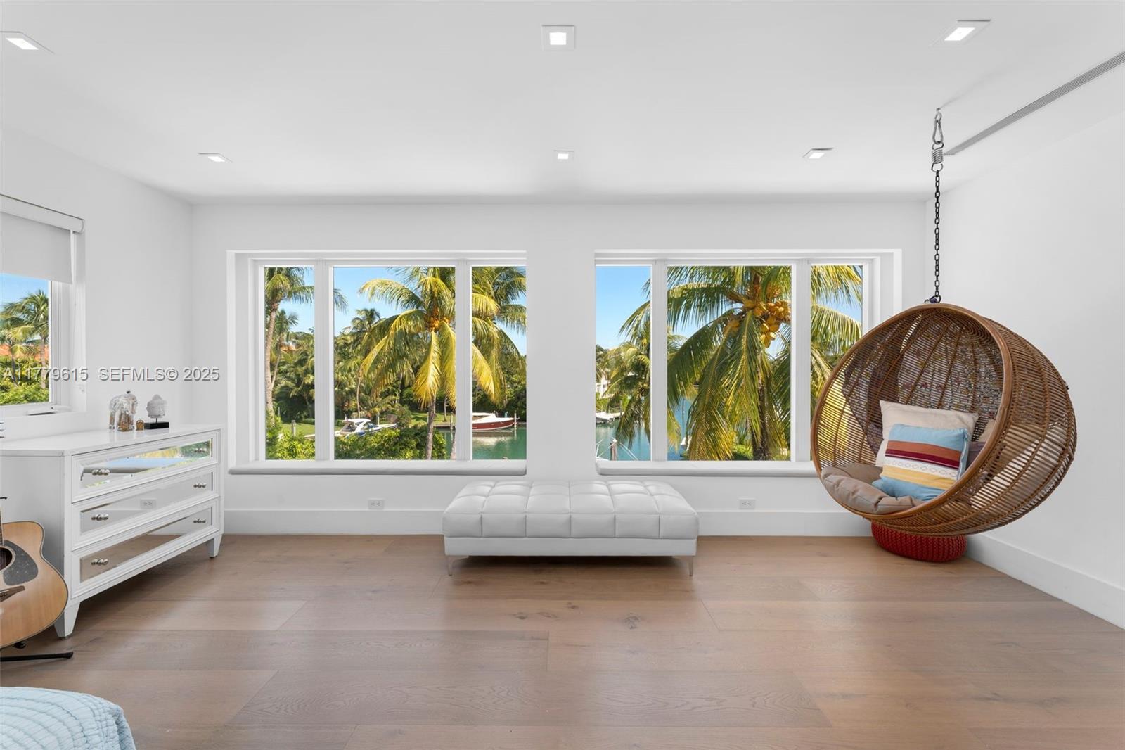 481 South Mashta Drive Key Biscayne, FL 33149 - Photo 32 of 57 a view of room with furniture and a flat screen tv