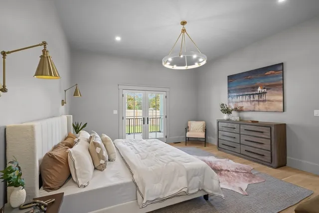 a bedroom with a large bed and a window