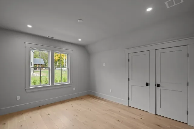 a bathroom with a double vanity sink and mirror