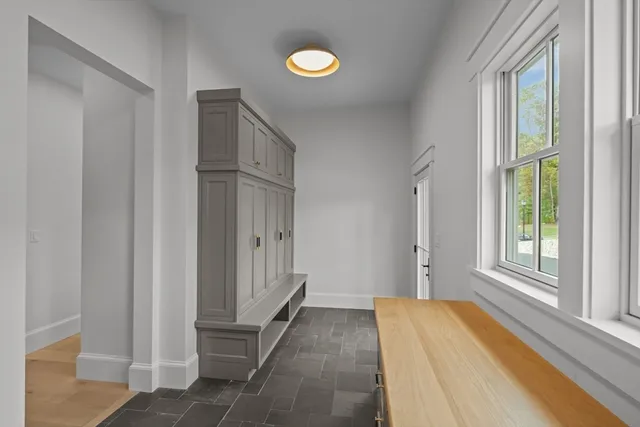 a living room with furniture a window and a fireplace