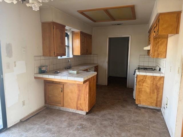 17067 Avon Way Madera, CA 93638 - Photo 2 of 14 a utility room with cabinets washer and dryer