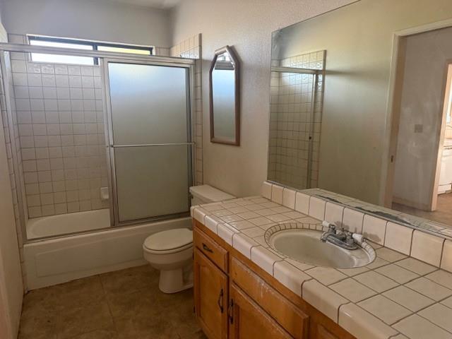 17067 Avon Way Madera, CA 93638 - Photo 5 of 14 a bathroom with a sink and mirror with toilet