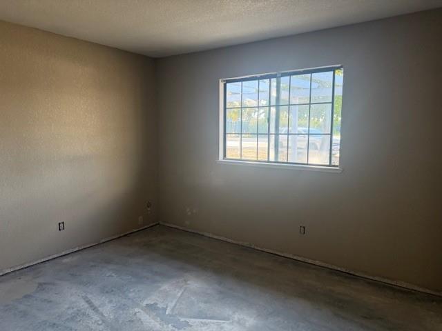 17067 Avon Way Madera, CA 93638 - Photo 7 of 14 an empty room with a window