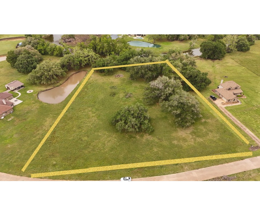1207 Mill Road Angleton, TX 77515 - Photo 1 of 19 a view of a swimming pool
