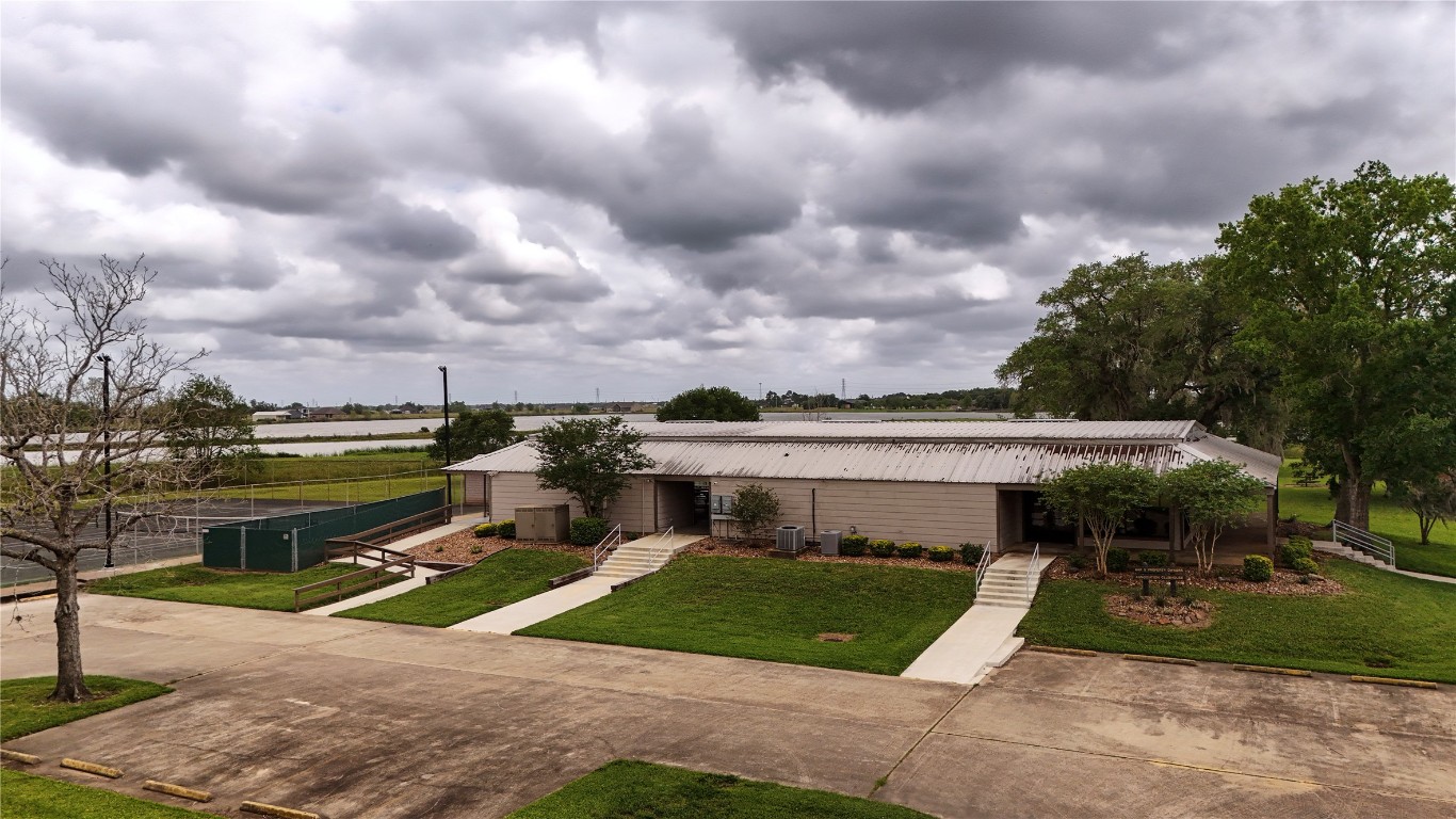 1207 Mill Road Angleton, TX 77515 - Photo 14 of 19 a front view of house with yard and green space