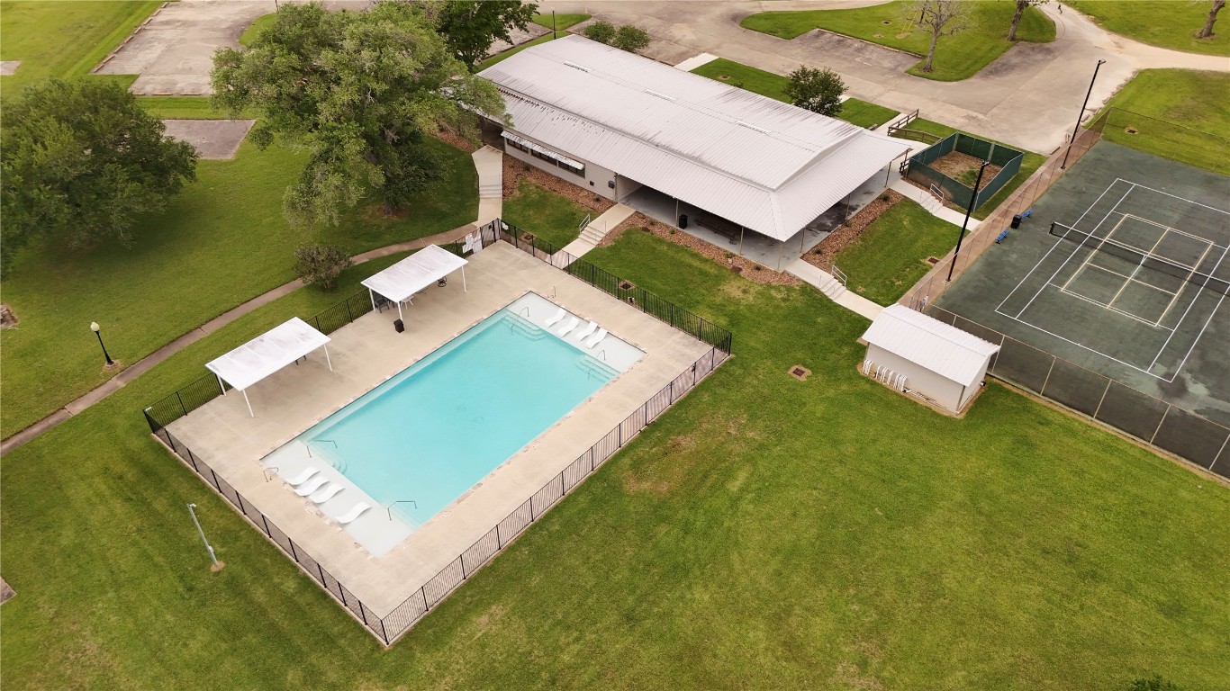 1207 Mill Road Angleton, TX 77515 - Photo 17 of 19 an aerial view of a house with a garden and swimming pool