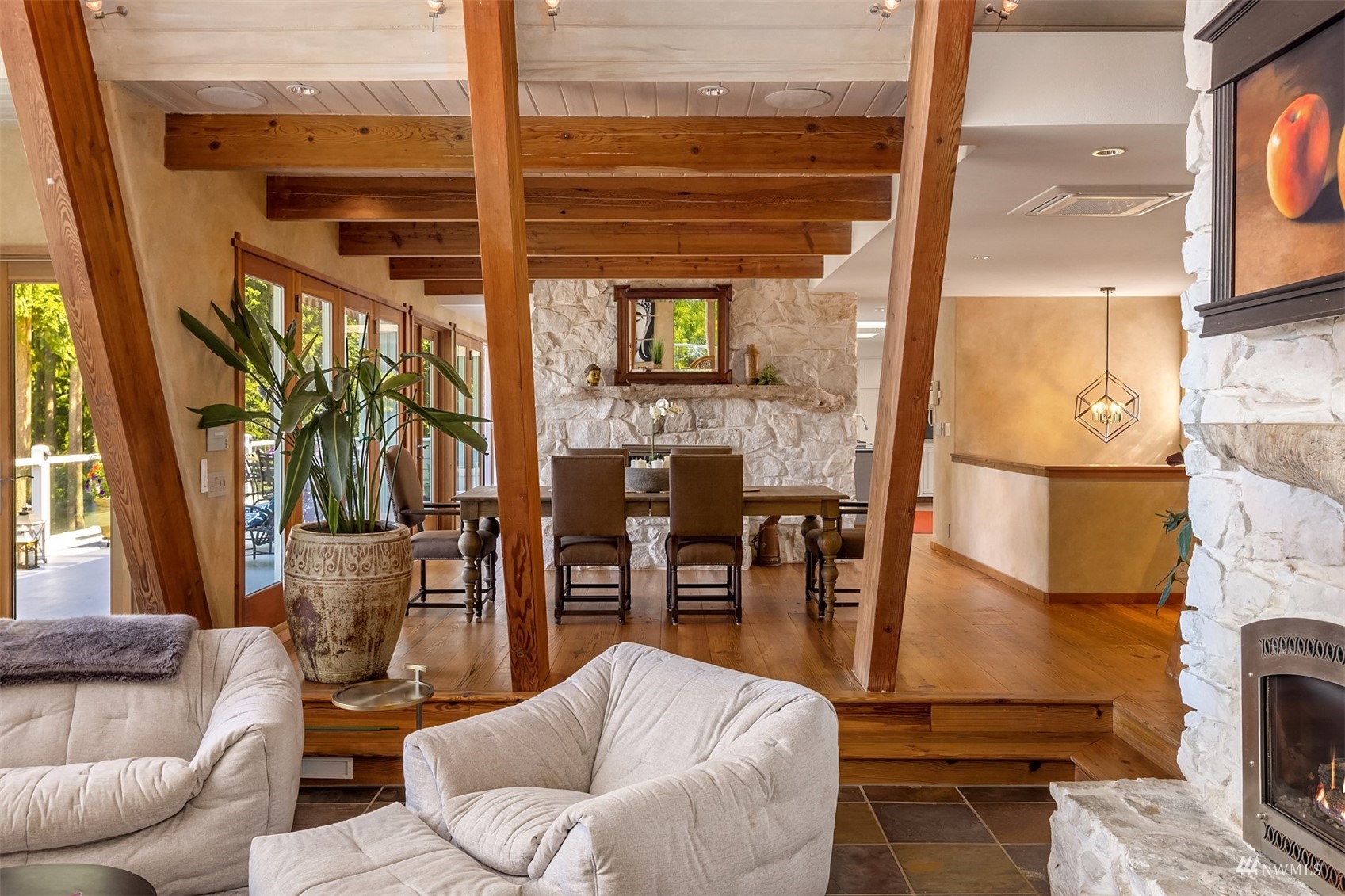 7382 View Park Road Southeast Port Orchard, WA 98367 - Photo 12 of 40 a living room with furniture a fireplace and a floor to ceiling window
