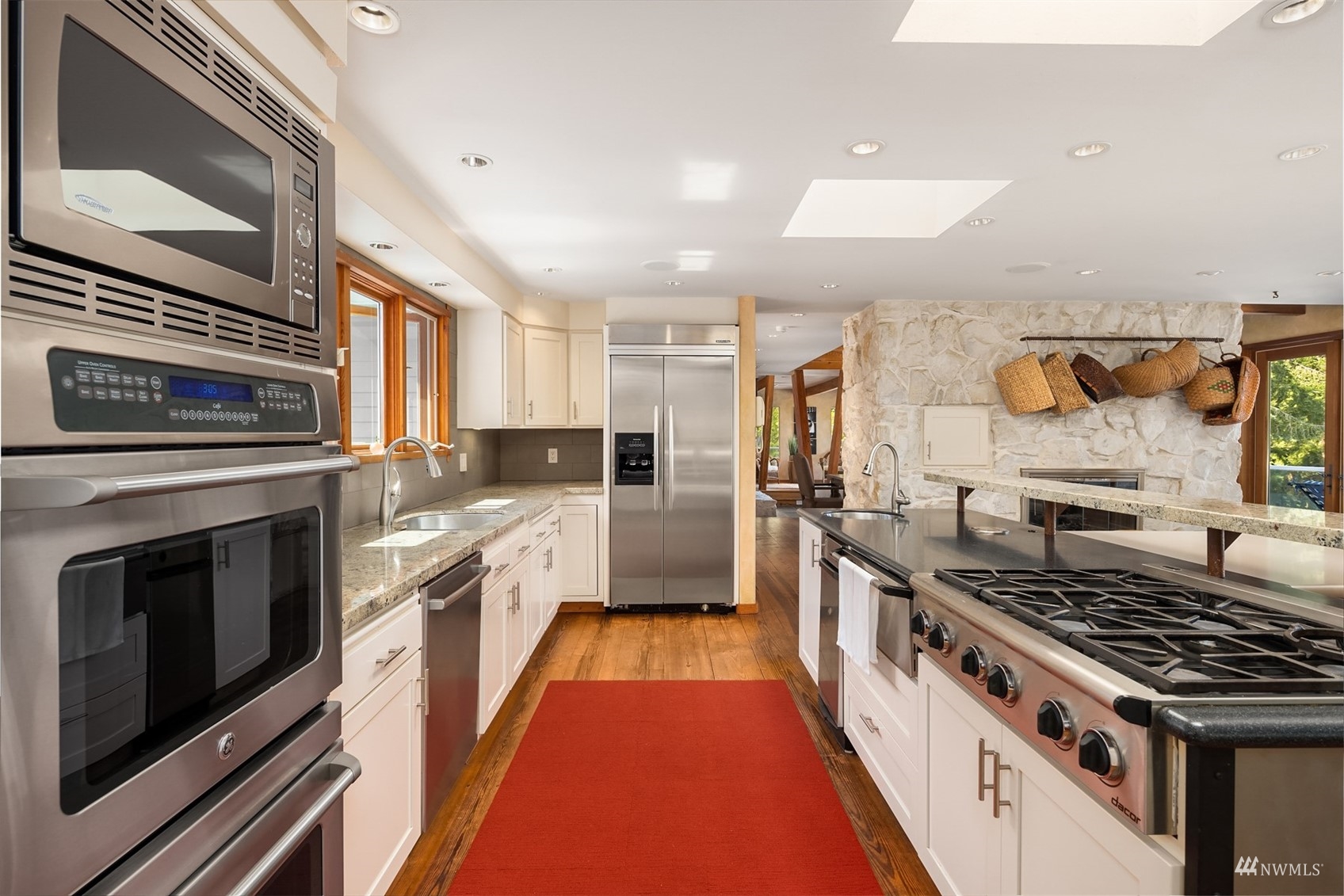 7382 View Park Road Southeast Port Orchard, WA 98367 - Photo 14 of 40 a large kitchen with stainless steel appliances granite countertop a stove and a sink