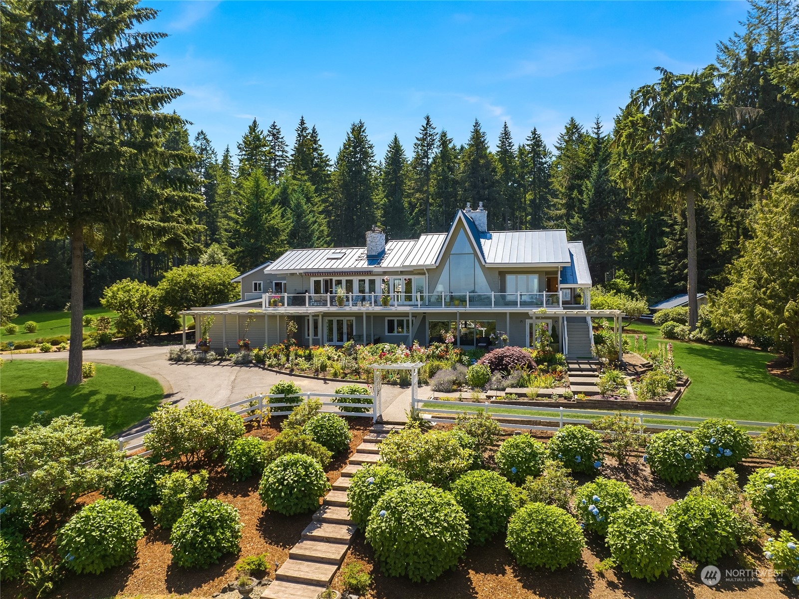 7382 View Park Road Southeast Port Orchard, WA 98367 - Photo 2 of 40 a front view of a house with garden