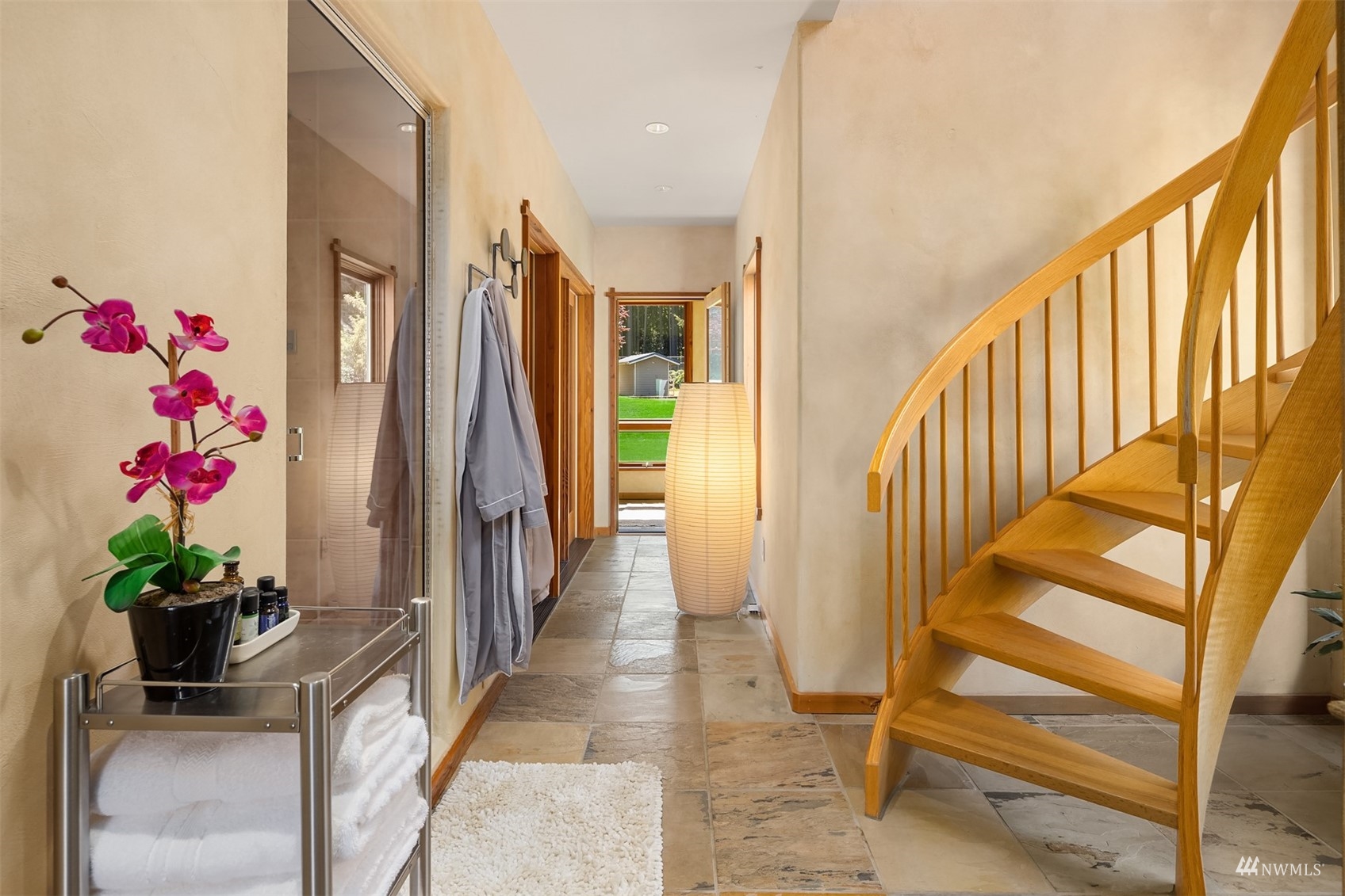 7382 View Park Road Southeast Port Orchard, WA 98367 - Photo 21 of 40 a view of an entryway with wooden floor and a potted plant