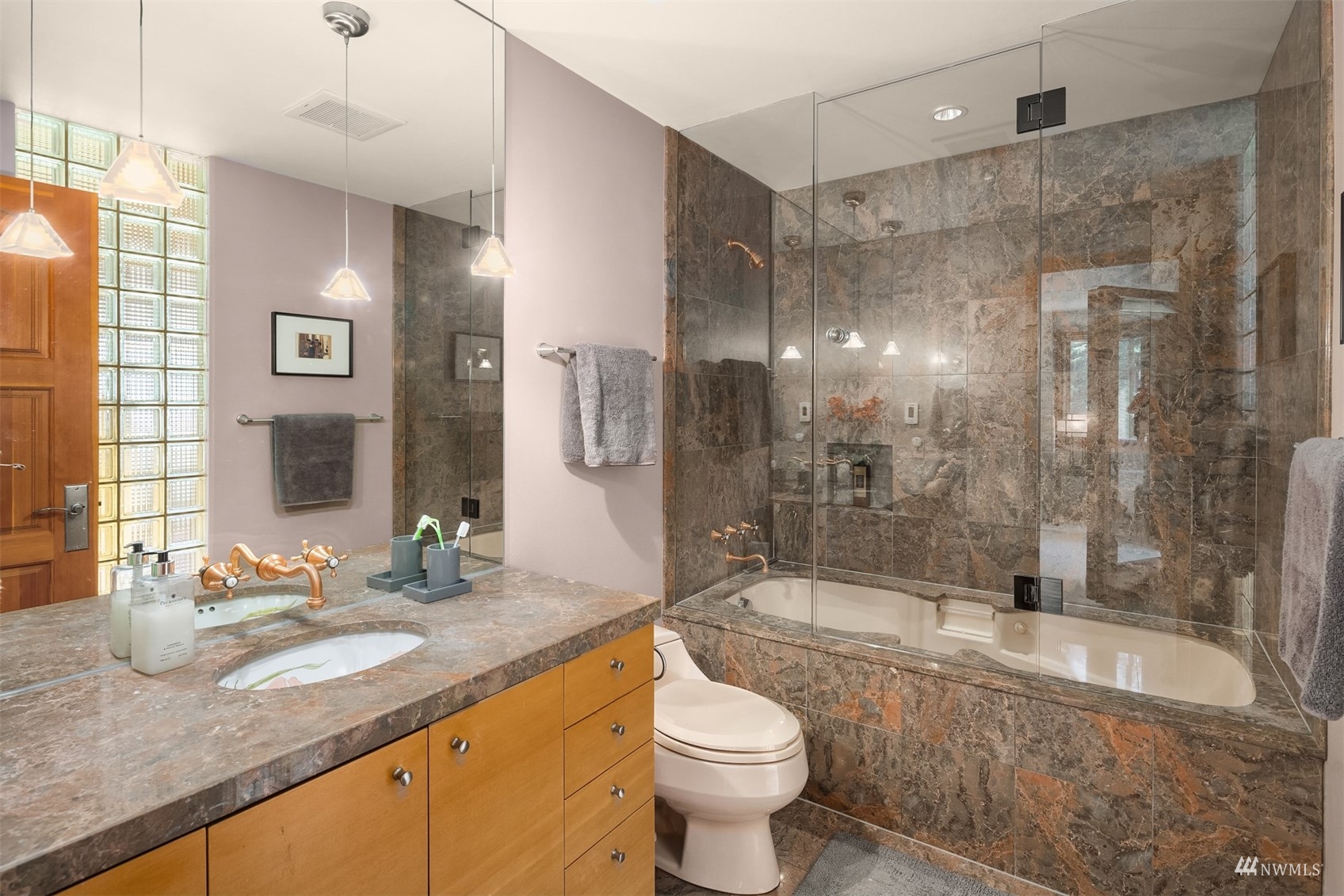 7382 View Park Road Southeast Port Orchard, WA 98367 - Photo 24 of 40 a bathroom with a granite countertop sink toilet mirror and bathtub