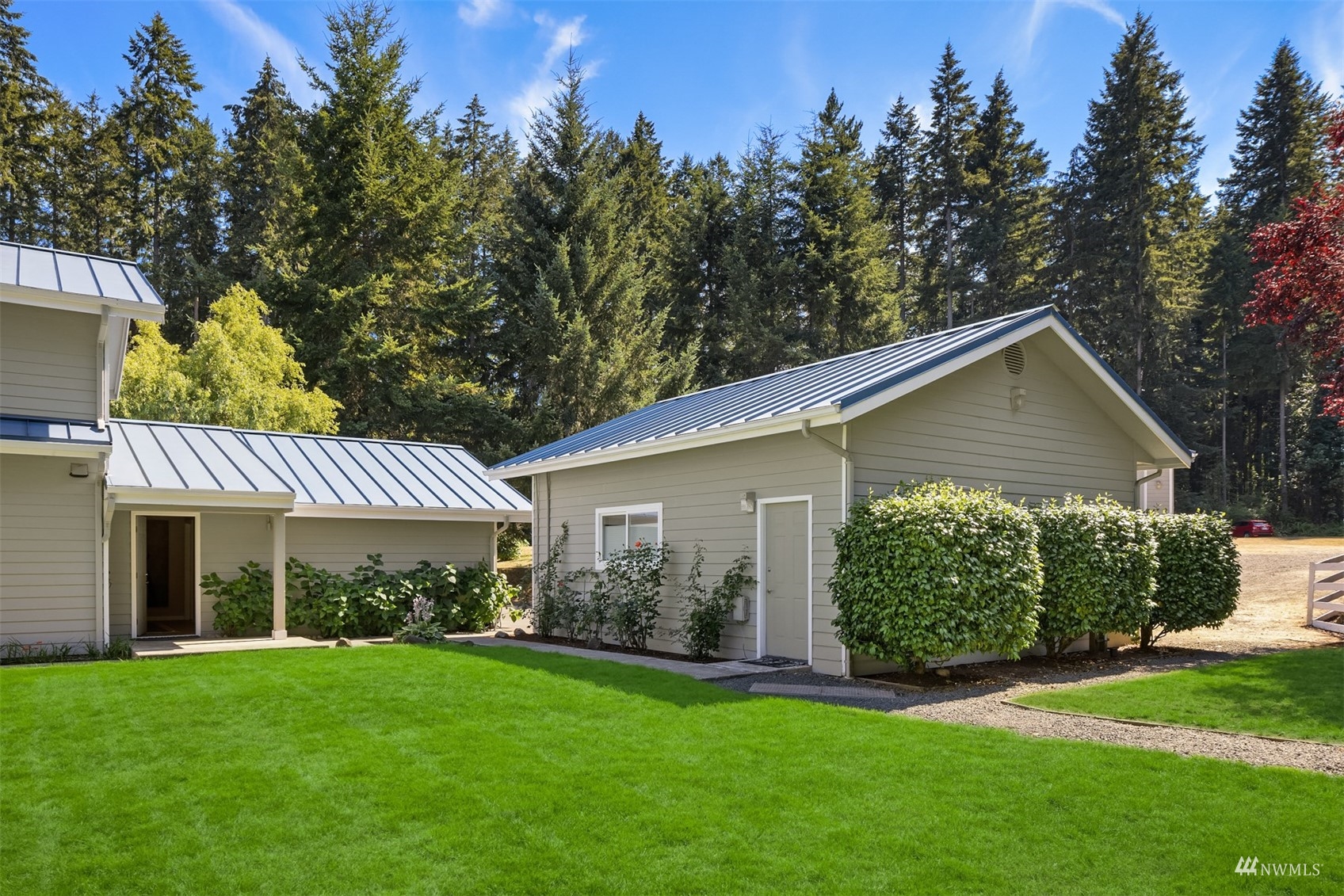 7382 View Park Road Southeast Port Orchard, WA 98367 - Photo 31 of 40 a front view of a house with a yard and garage
