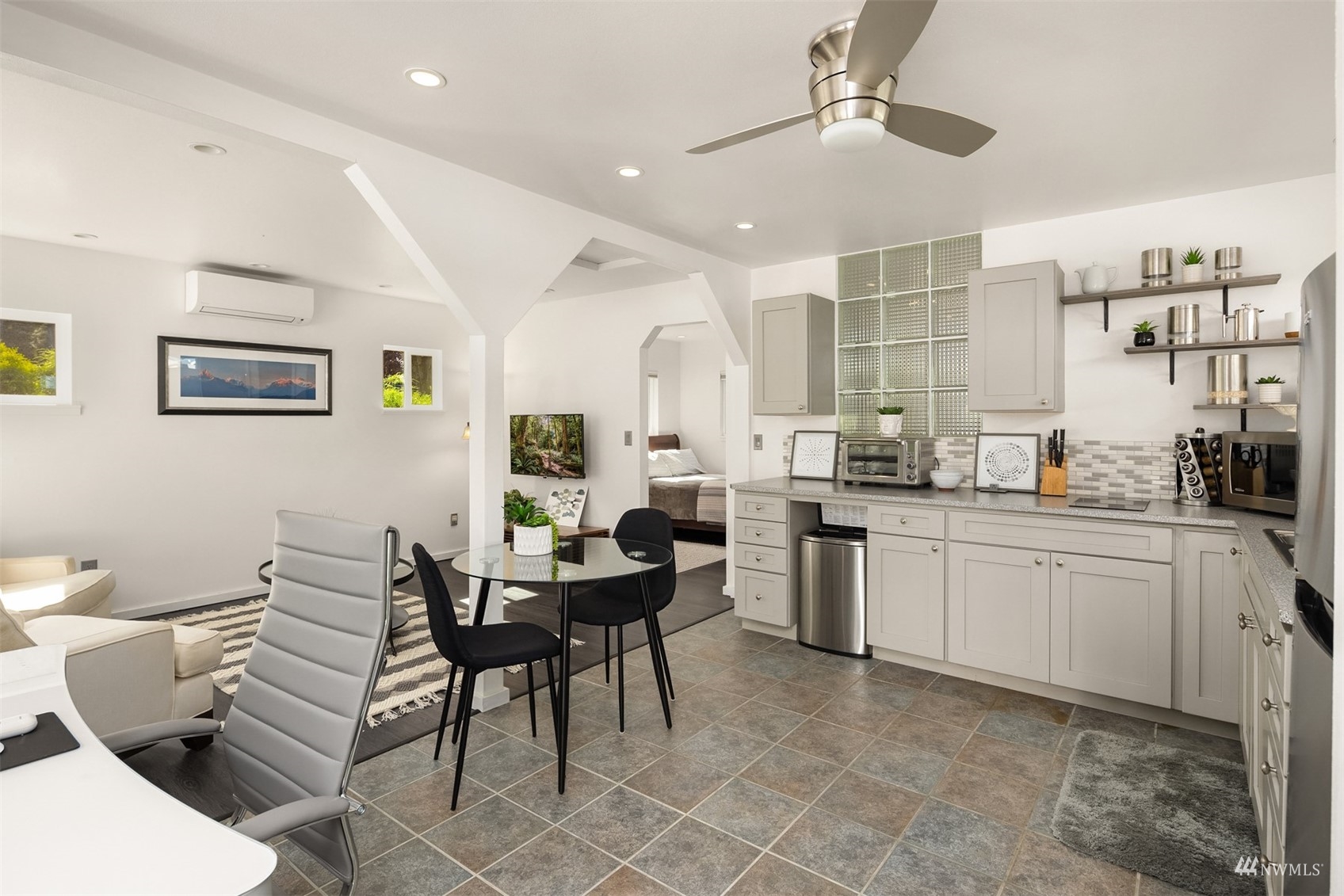 7382 View Park Road Southeast Port Orchard, WA 98367 - Photo 32 of 40 a open dining room with stainless steel appliances kitchen island granite countertop furniture and a kitchen view