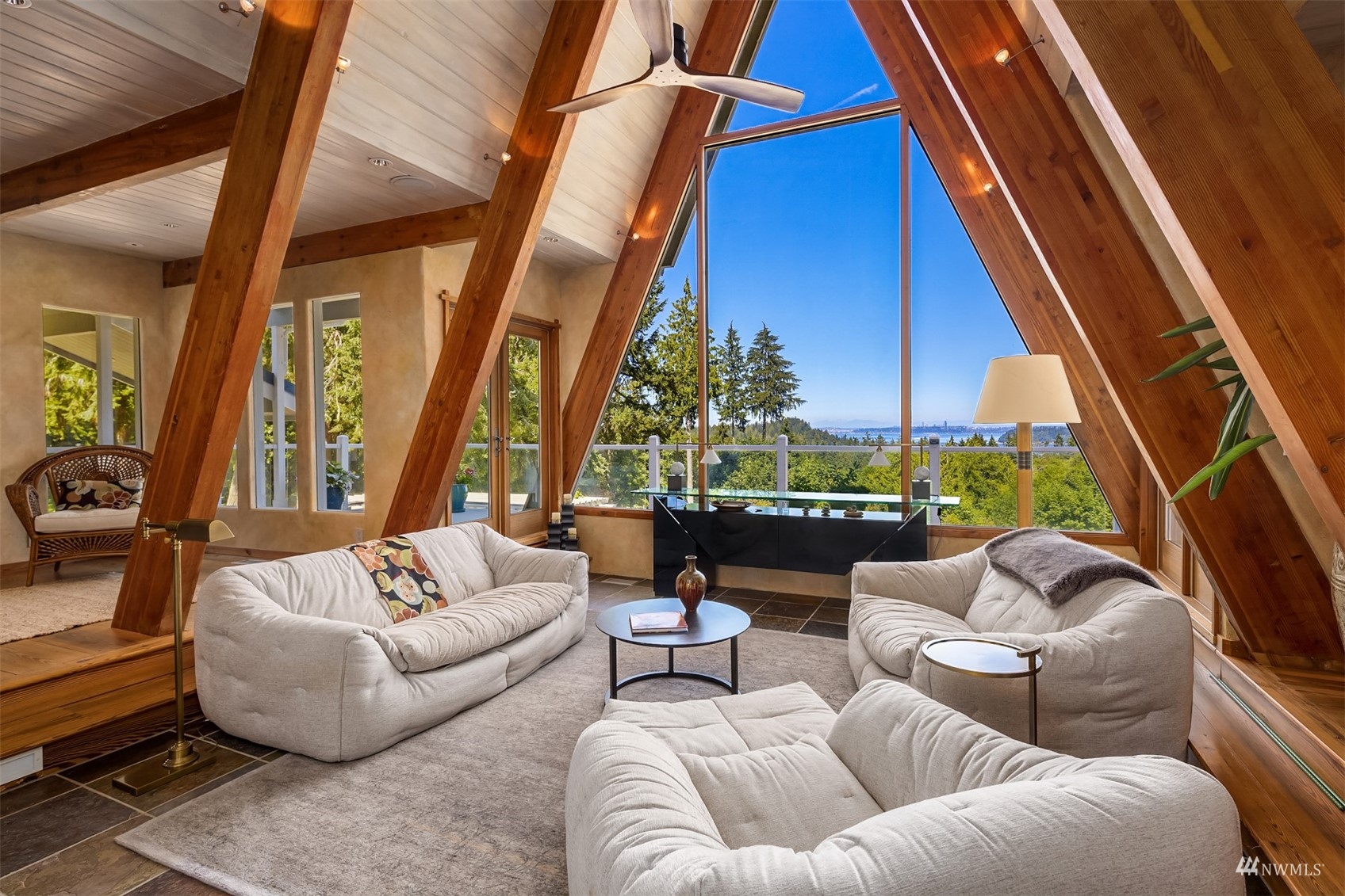 7382 View Park Road Southeast Port Orchard, WA 98367 - Photo 10 of 40 a living room with furniture and a floor to ceiling window
