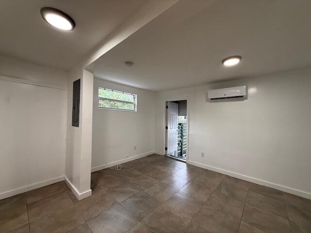 919 2nd Street, Unit 2 West Palm Beach, FL 33401 - Photo 12 of 14 an empty room with windows and entrance