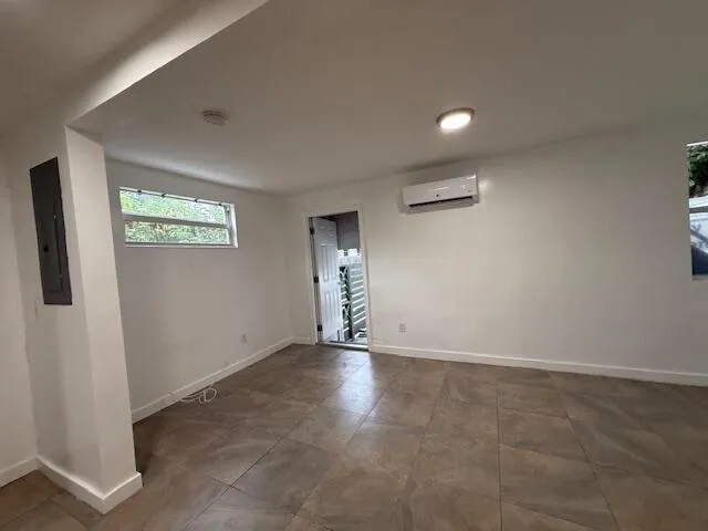 a view of a livingroom and a kitchen