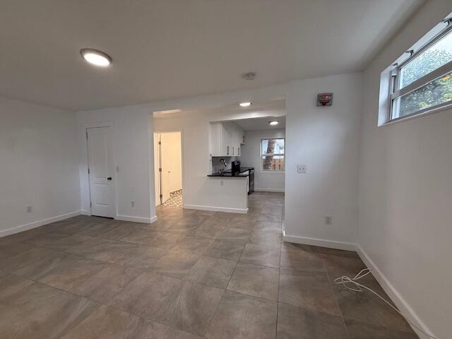 919 2nd Street, Unit 2 West Palm Beach, FL 33401 - Photo 7 of 14 an empty room with a kitchen and a window