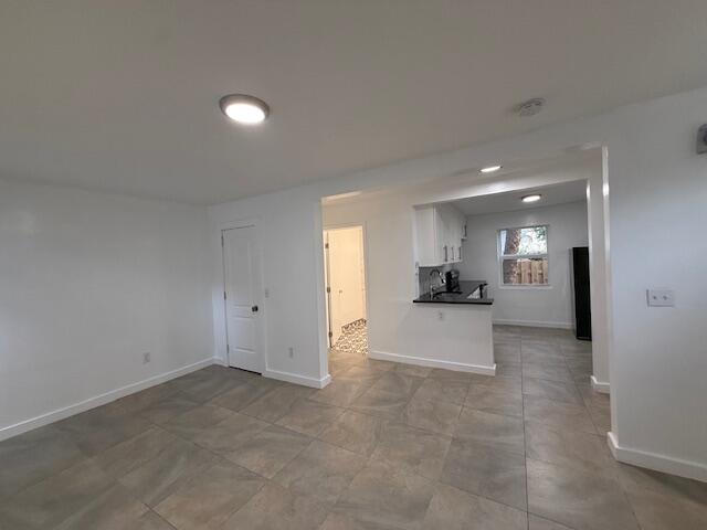 919 2nd Street, Unit 2 West Palm Beach, FL 33401 - Photo 8 of 14 a view of a kitchen with a sink and a stove top oven