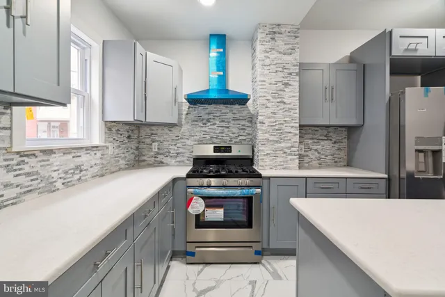 a kitchen with granite countertop a stove and a sink