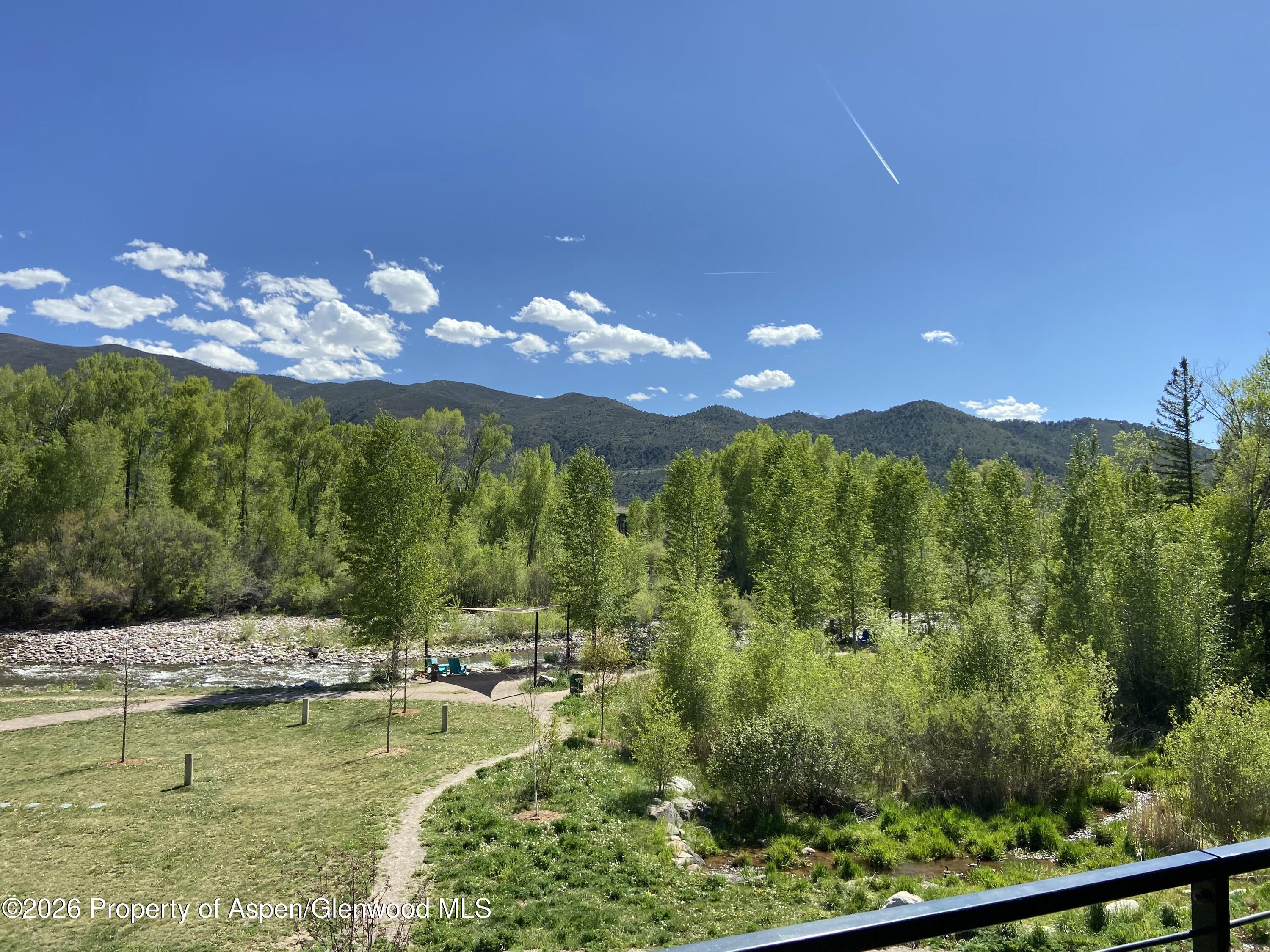 22860 2 Rivers Road, Unit 274 Basalt, CO 81621 - Photo 5 of 13 a view of a swimming pool with a yard