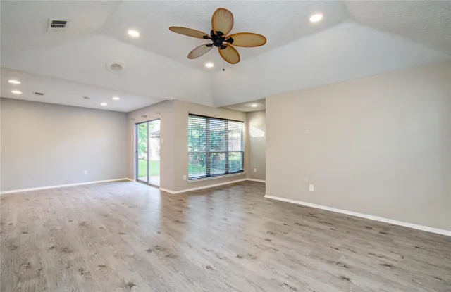 a bathroom with a sink a toilet a shower and a mirror