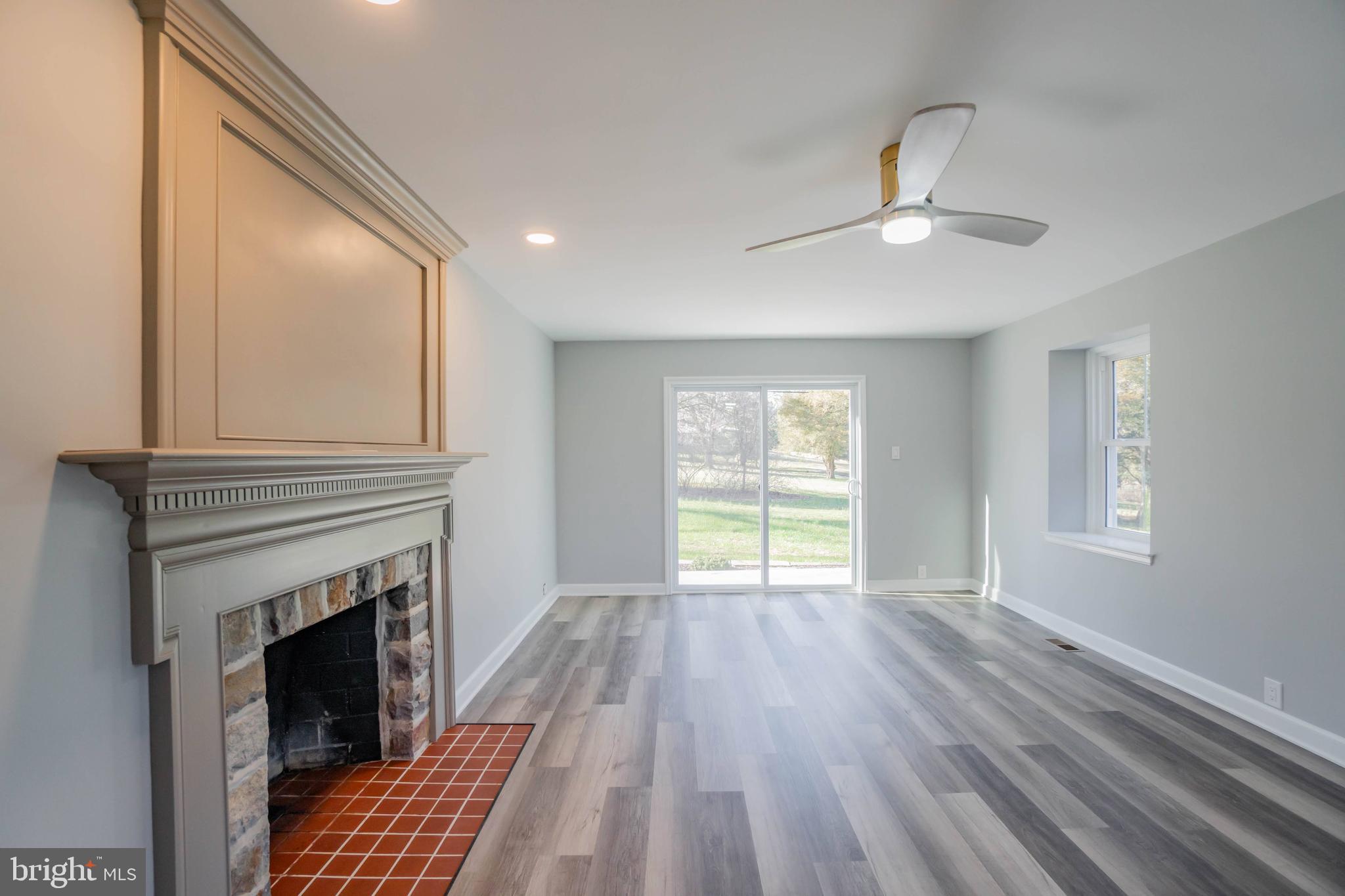 515 Rosedale Drive Pottstown, PA 19464 - Photo 12 of 52 living room, FP, sliders to rear patior & yard