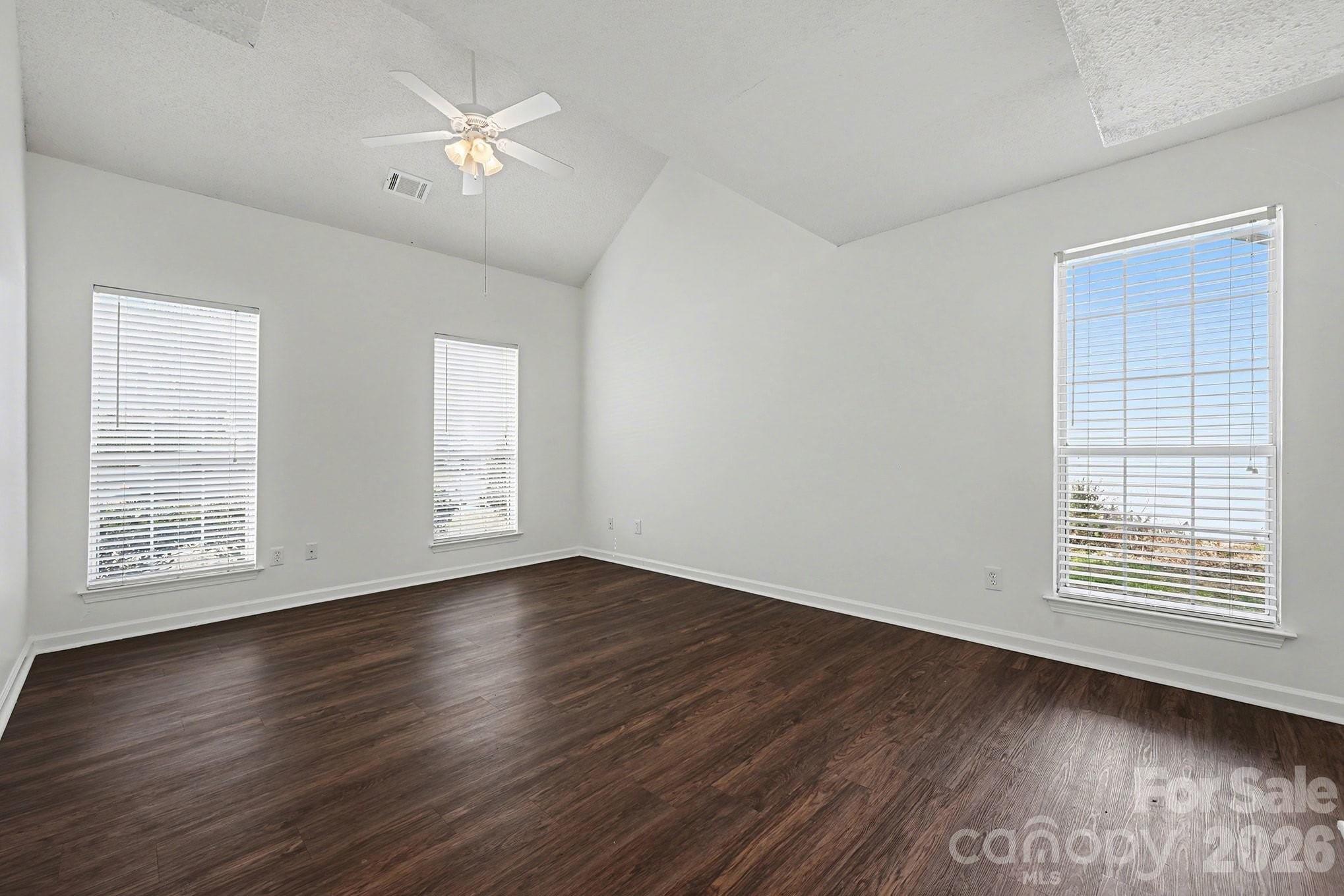 3402 Mayhurst Drive Indian Trail, NC 28079 - Photo 11 of 23 a view of an empty room with wooden floor and a window