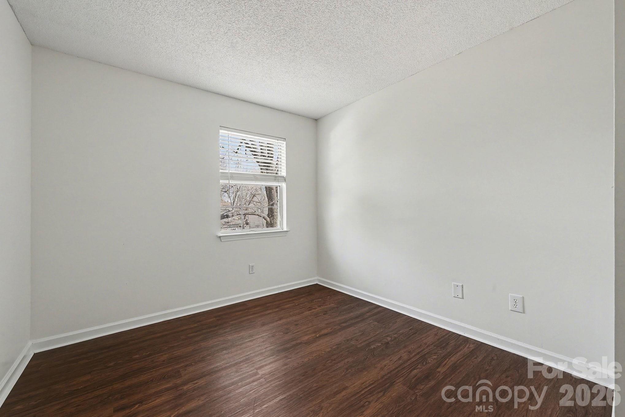 3402 Mayhurst Drive Indian Trail, NC 28079 - Photo 16 of 23 a view of an empty room with wooden floor