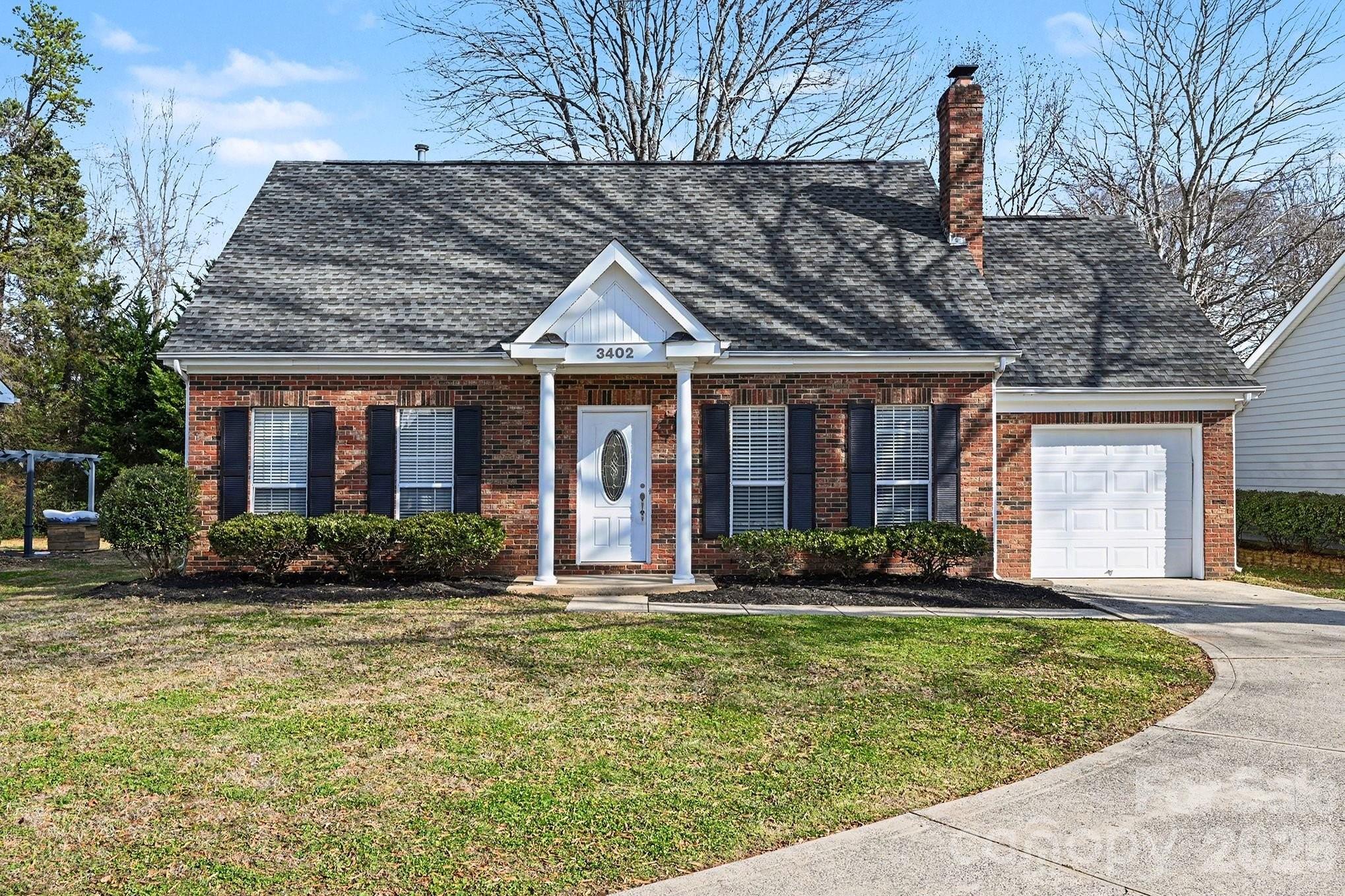 3402 Mayhurst Drive Indian Trail, NC 28079 - Photo 2 of 23 a front view of a house with garden