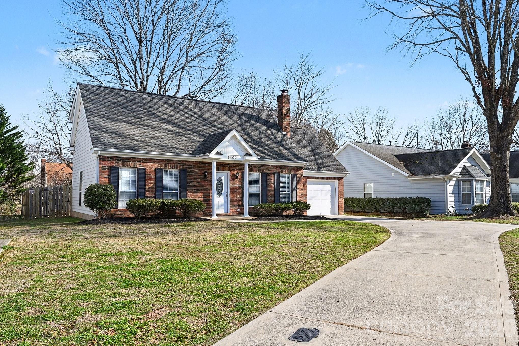 3402 Mayhurst Drive Indian Trail, NC 28079 - Photo 3 of 23 a front view of a house with a yard